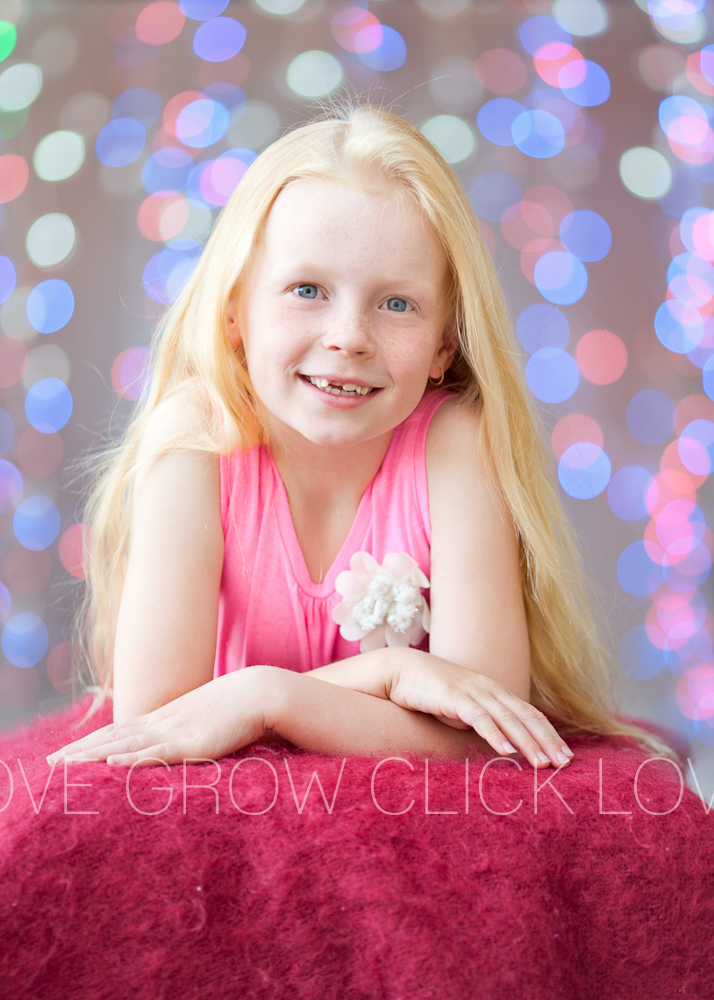 girl posing for a christmas lights photography shoot