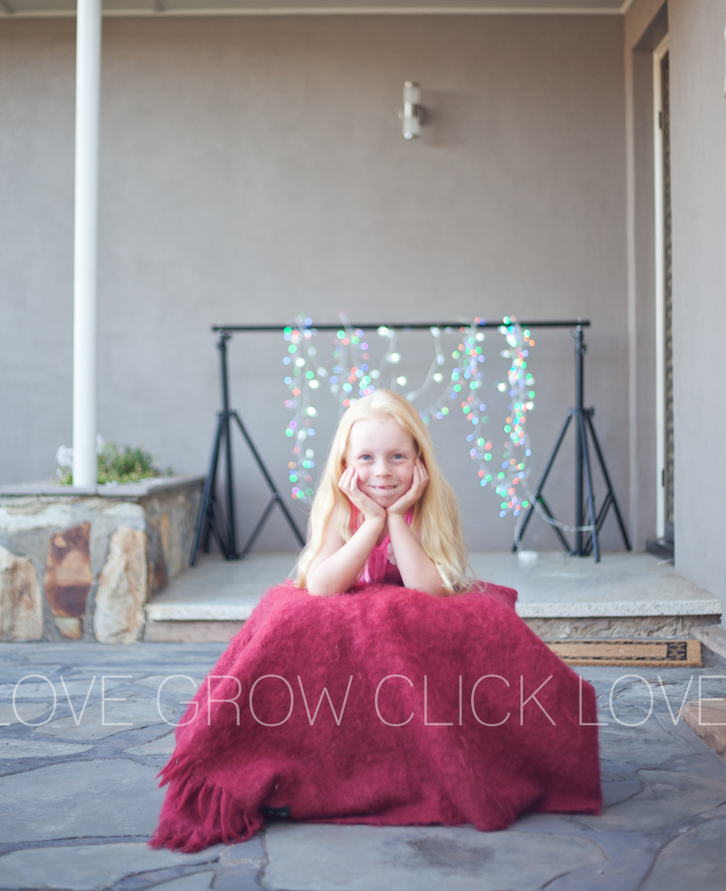 twinkle lights photo of girl smiling