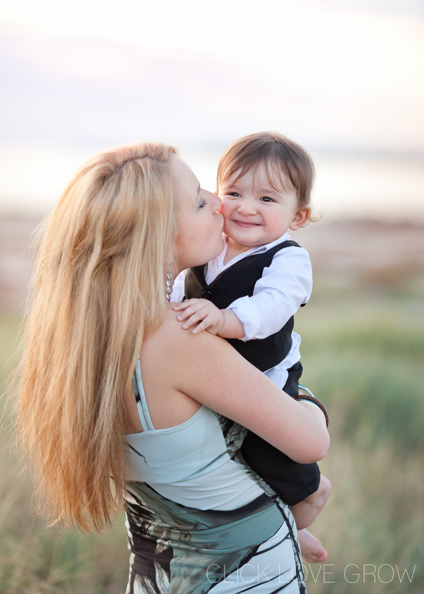 woman holding baby with shallow depth background