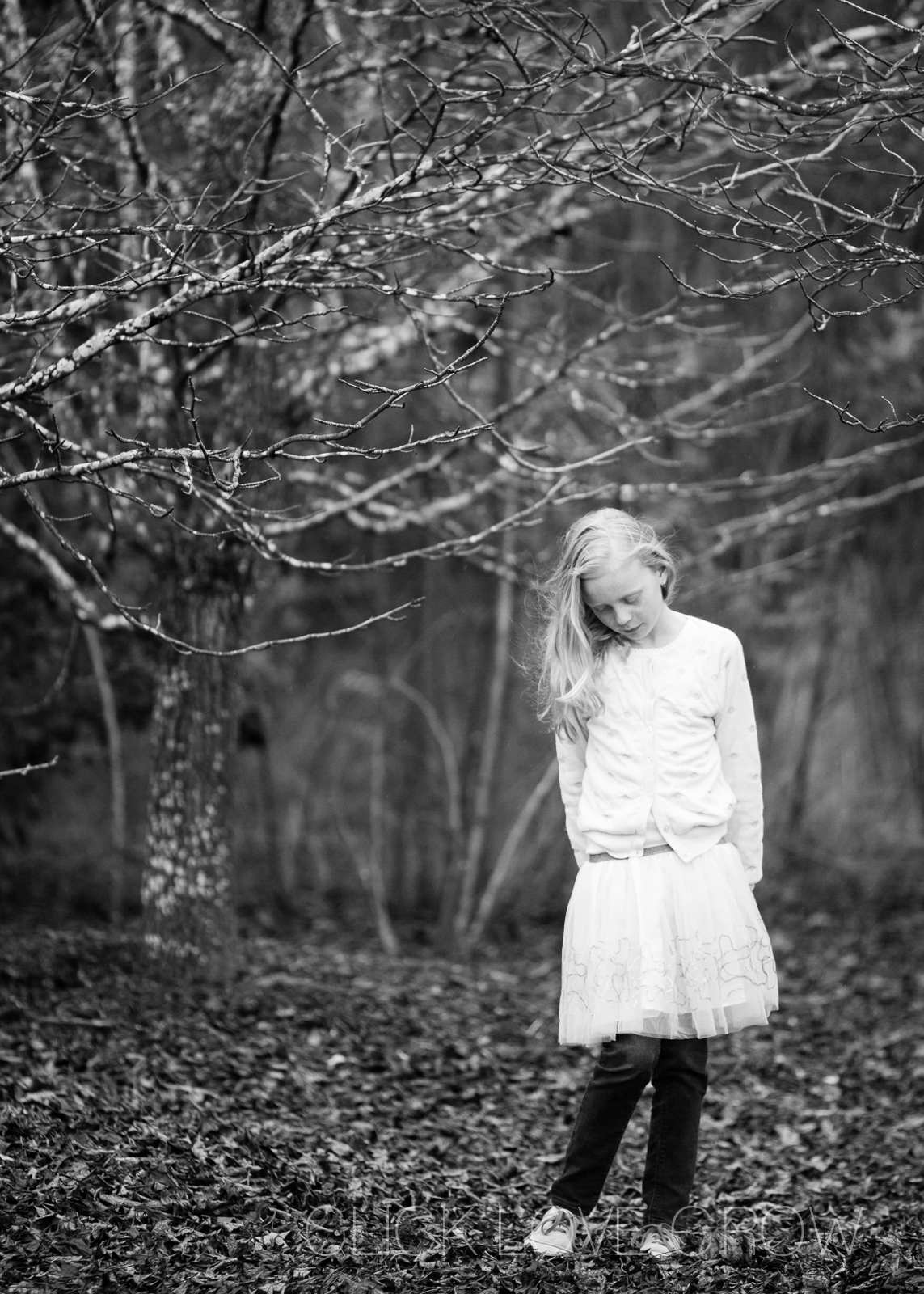 black and white photo of girl taken with the canon 135mm f2 lens
