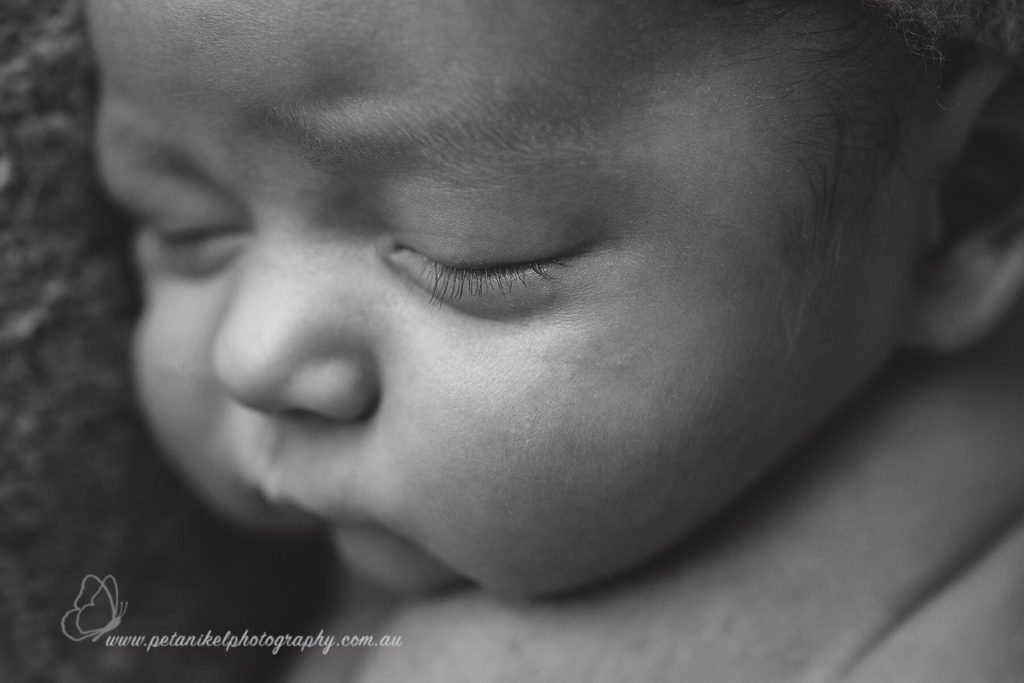 newborn baby eyelashes in focus
