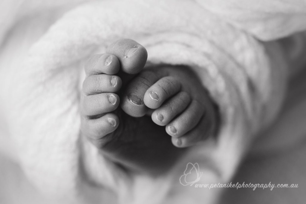 newborn’s toes macro infant photography