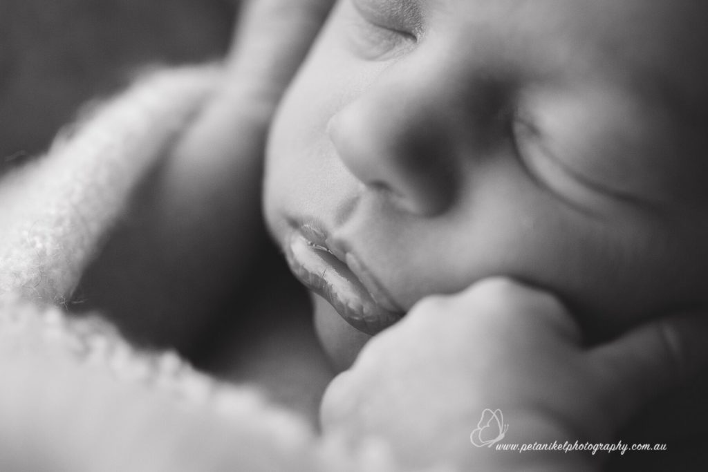 macro lens photography of newborn sleeping
