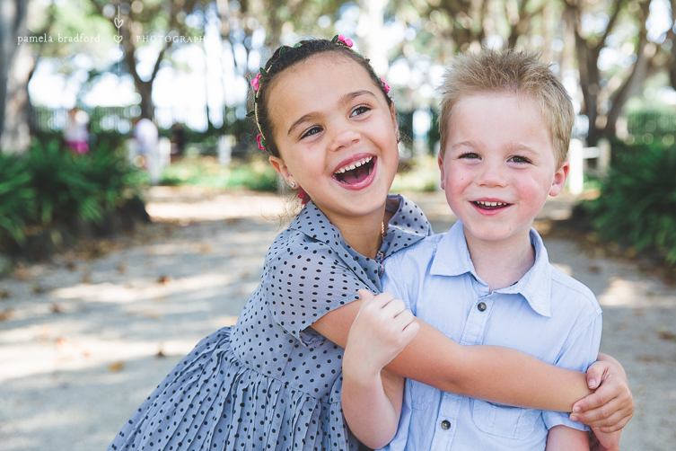 little girl hugging little boy