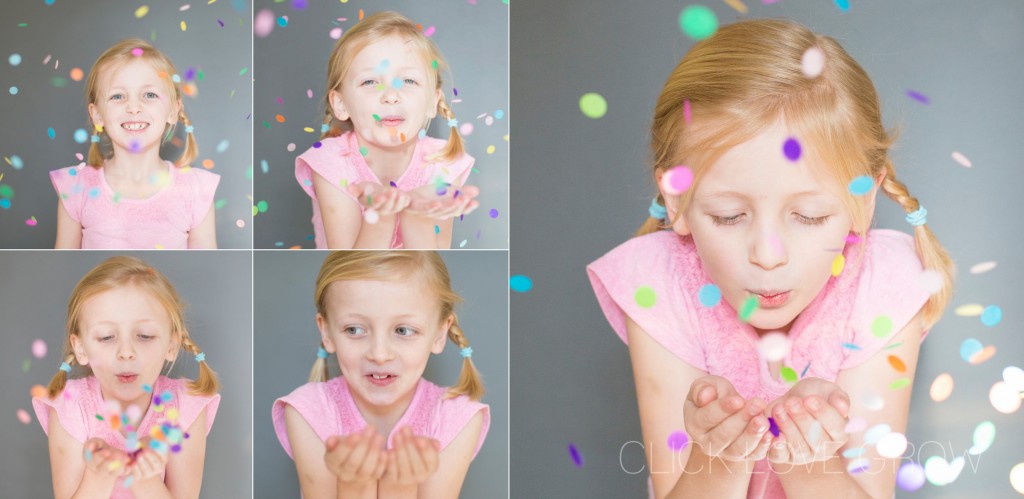 little girl blowing confetti