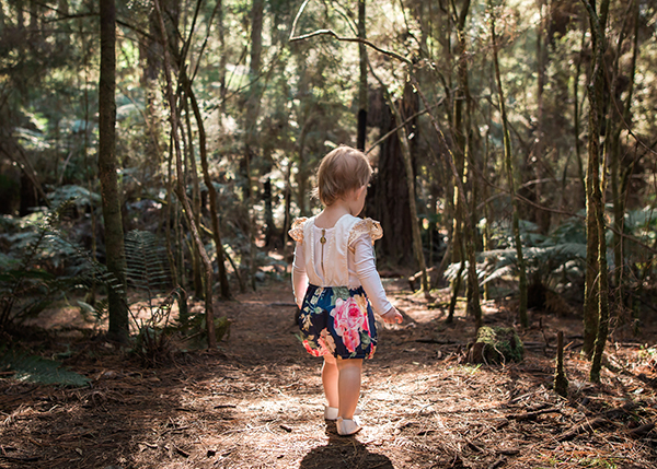 lifestyle photography of little girl in the forest