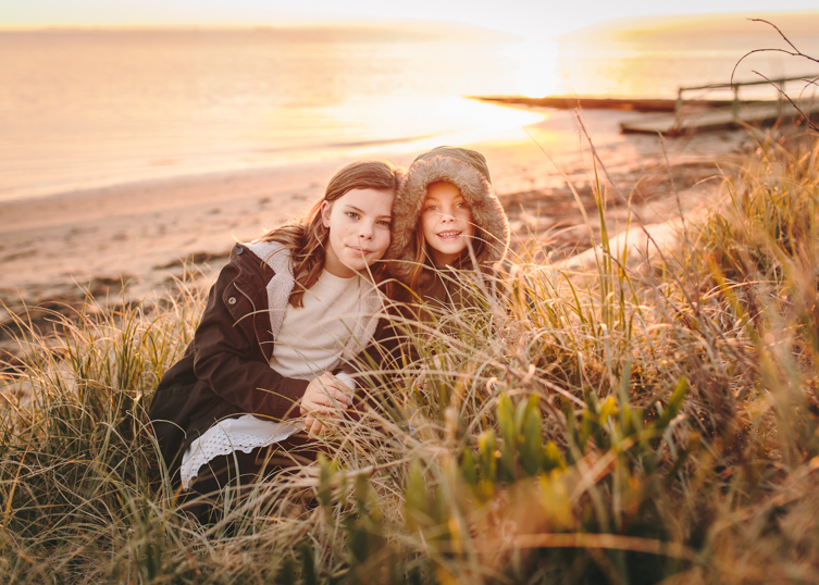 golden hour photography of two little girls