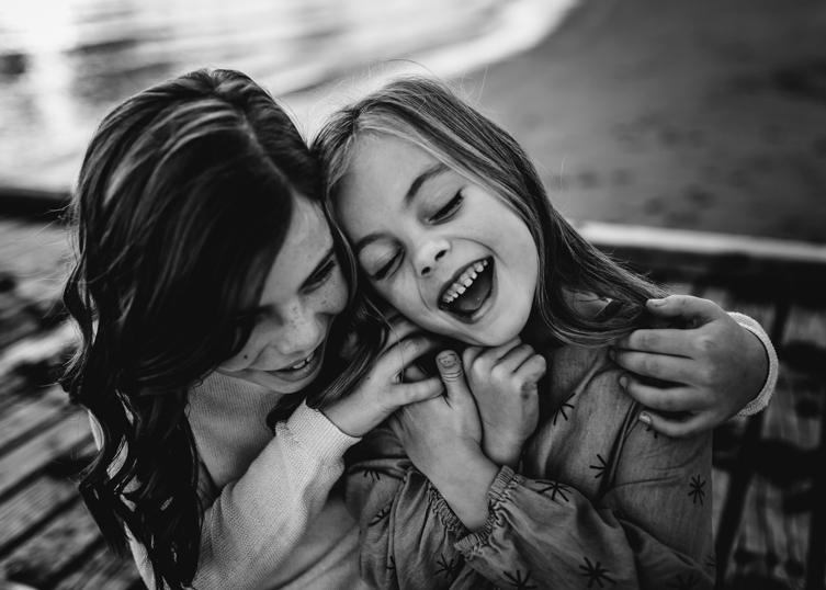 little girls laughing together
