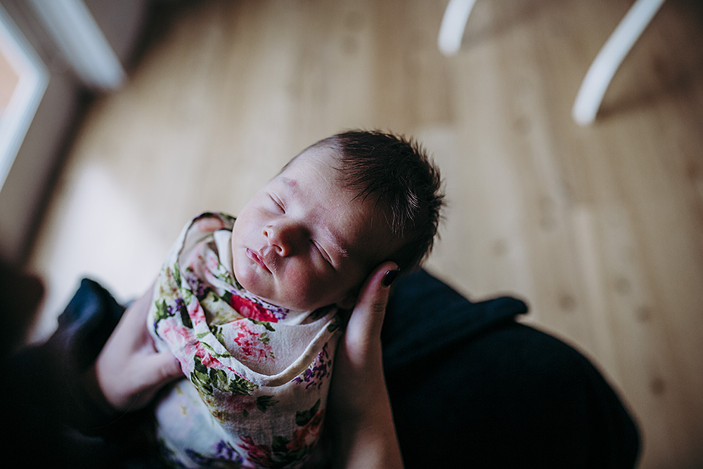 low light picture of newborn from top-down