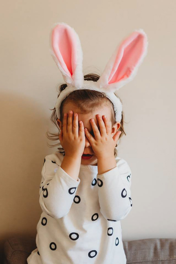 little girl with bunny ears