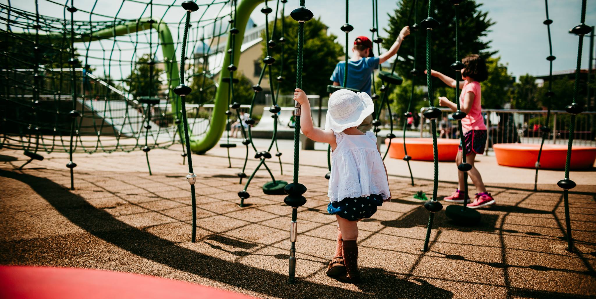 hard light photography of toddler at the playground