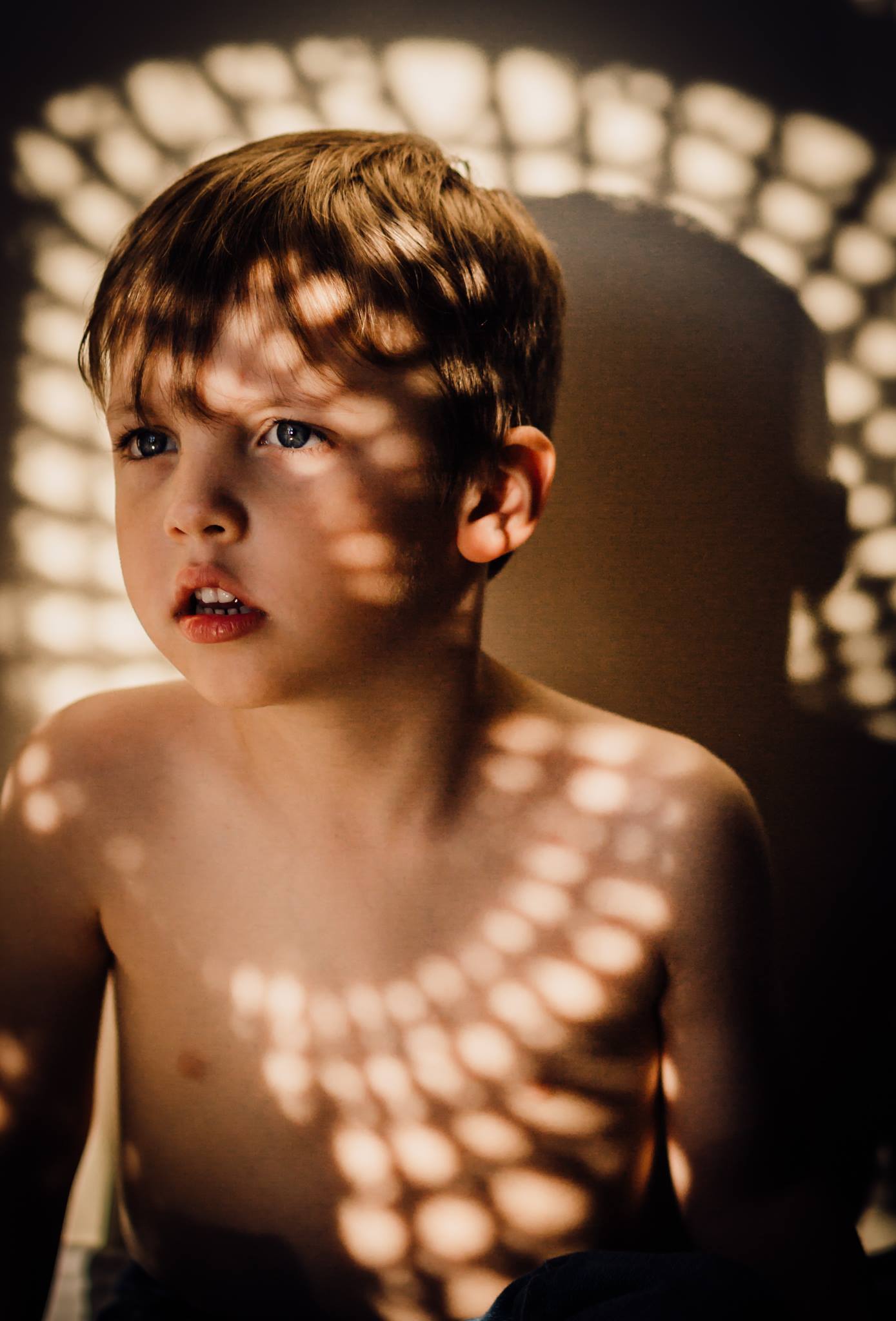  light and shadows over little boy