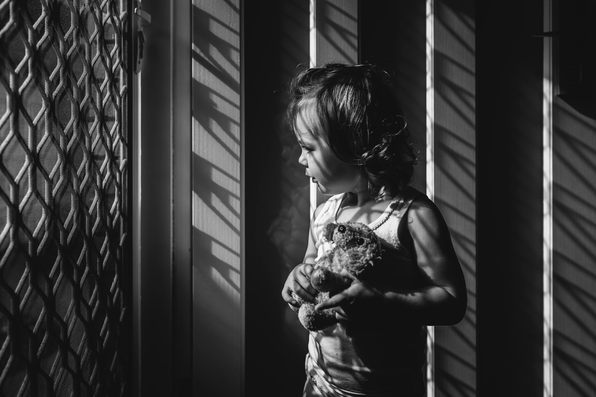 monochrome light and shadow photo of little girl
