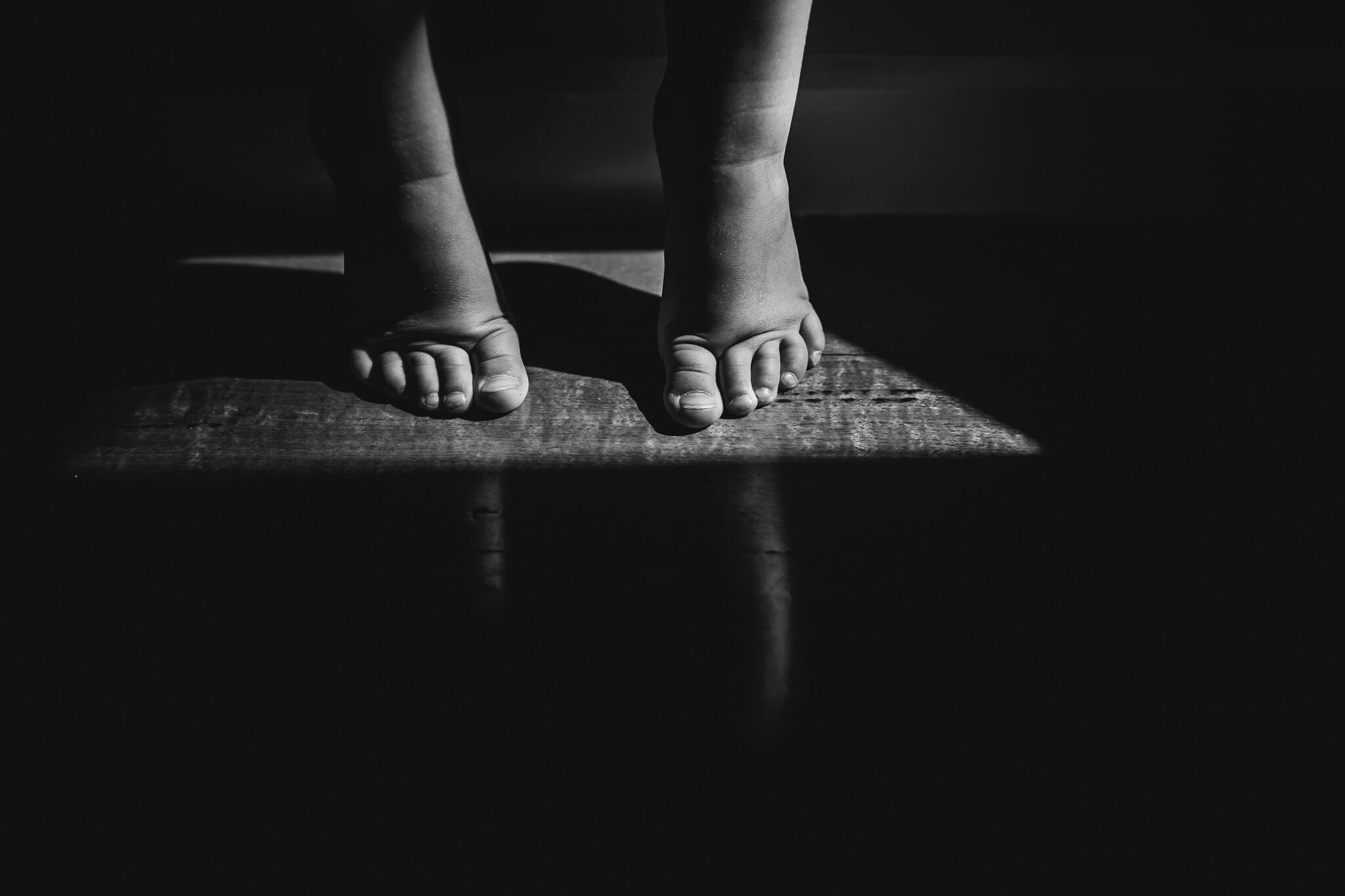 monochrome shadow image of little feet