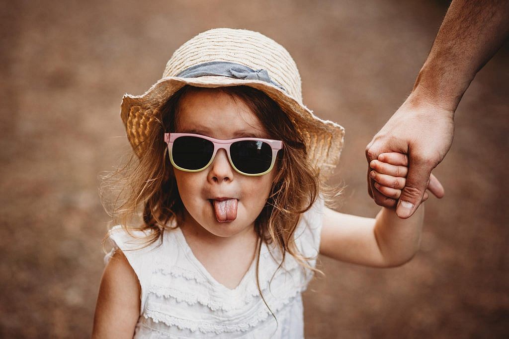 fun portrait of little girl with her tongue out