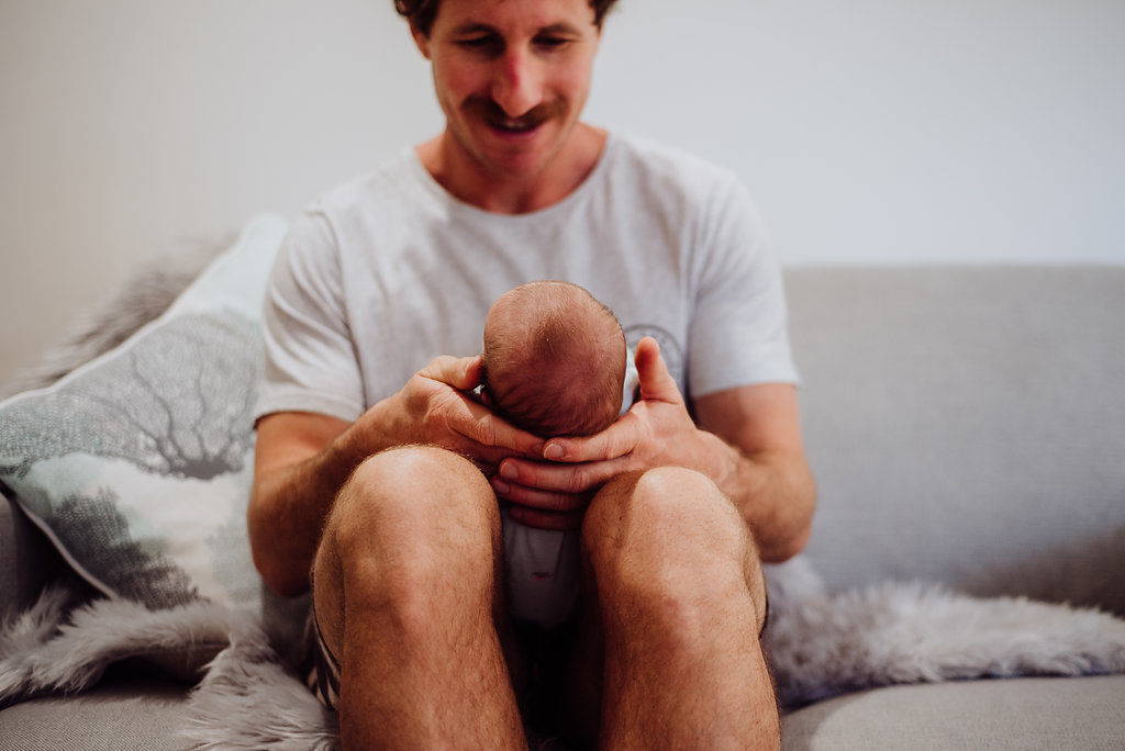 dad holding baby