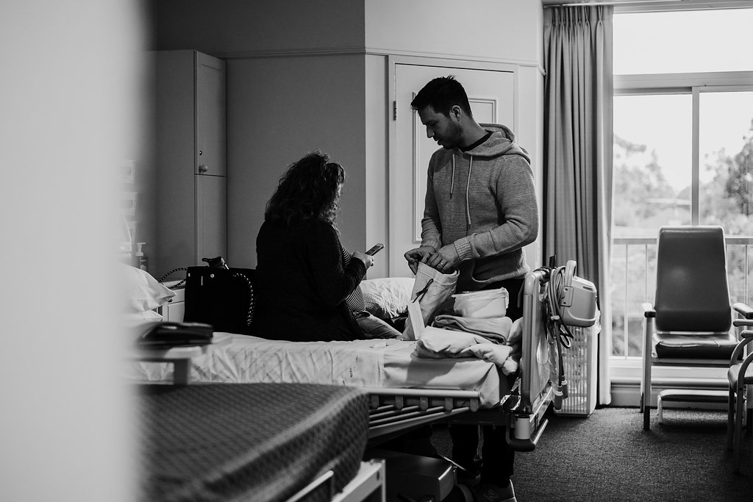 photos of couple in hospital room before c-section