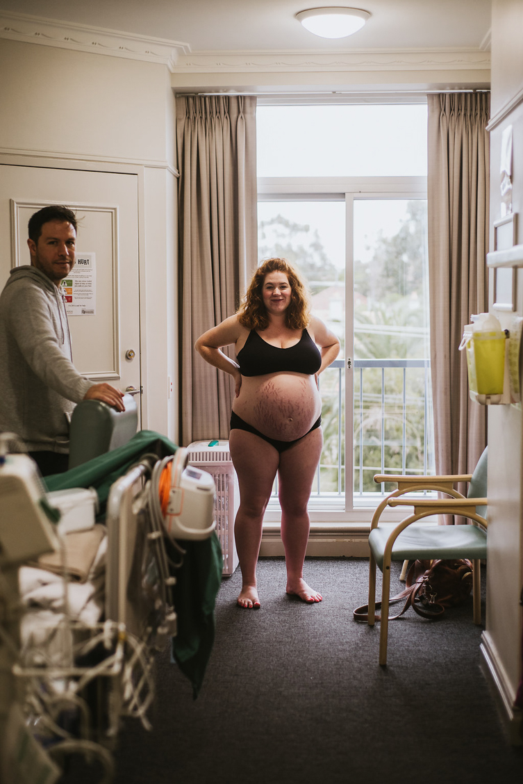pregnant woman with husband in hospital room
