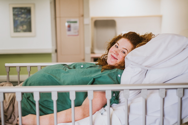 woman smiling from hospital bed