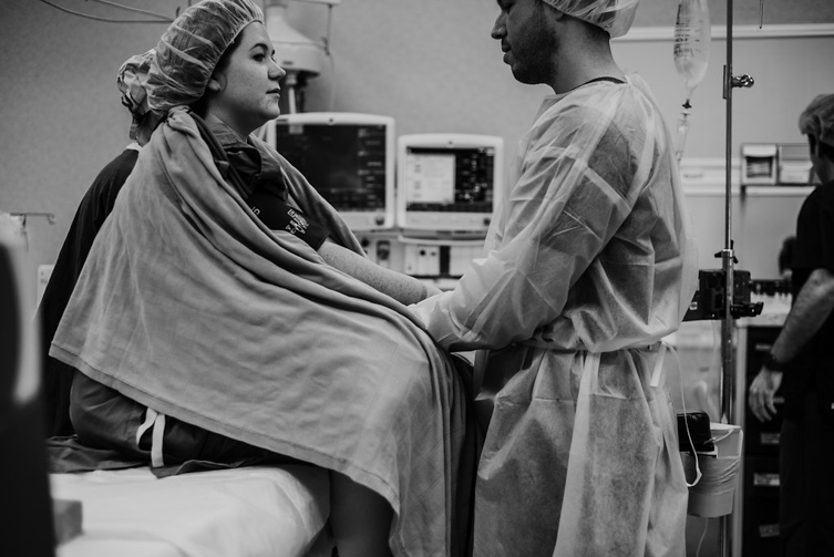 couple holding hands before c-section surgery
