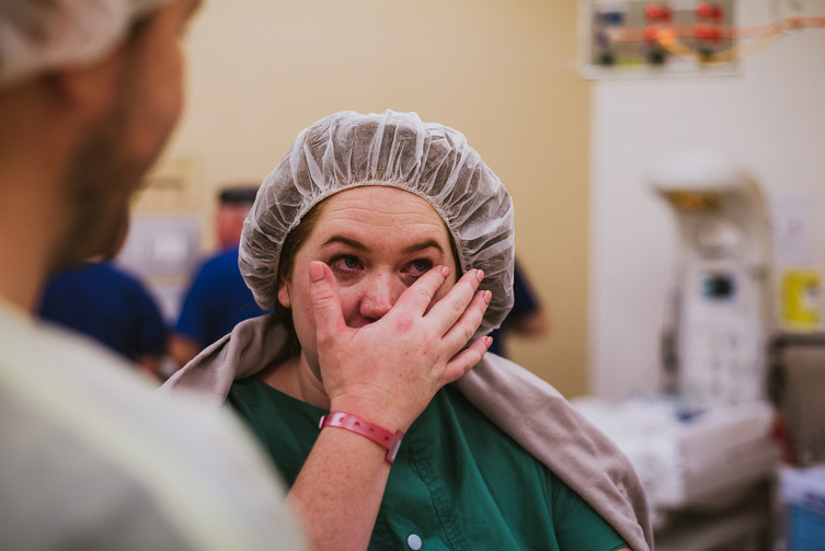 woman crying in the operating room