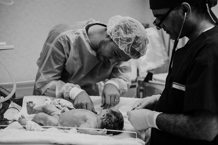 father looking at baby