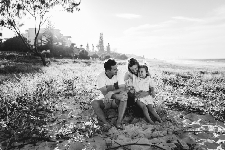 family of 3 photo ideas sitting at the beach