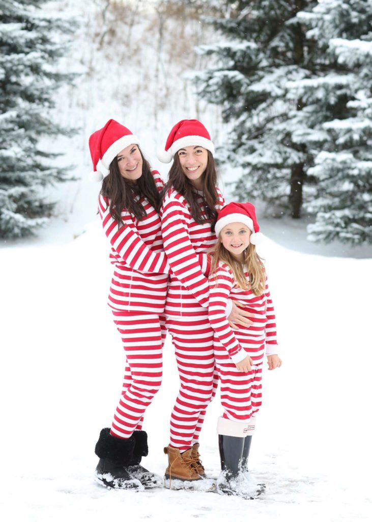 snow portraits of family wearing christmas pajamas