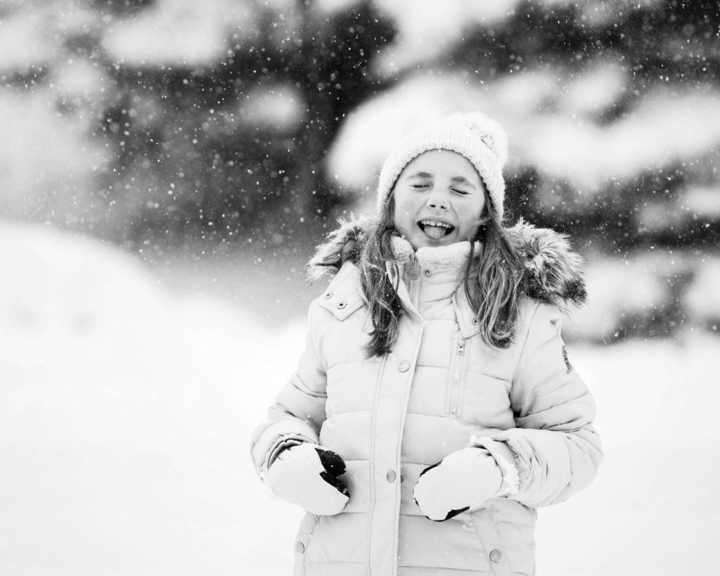 snow photography of girl laughing