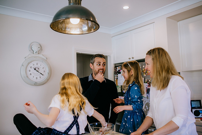 photography of family cooking together