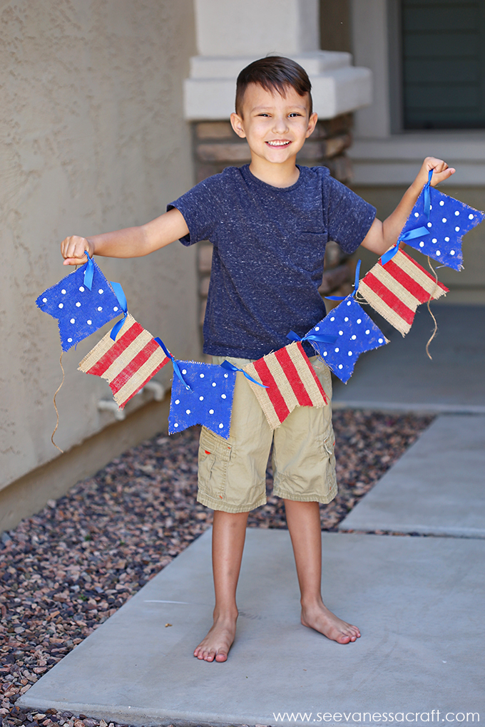  little boy holding american flag