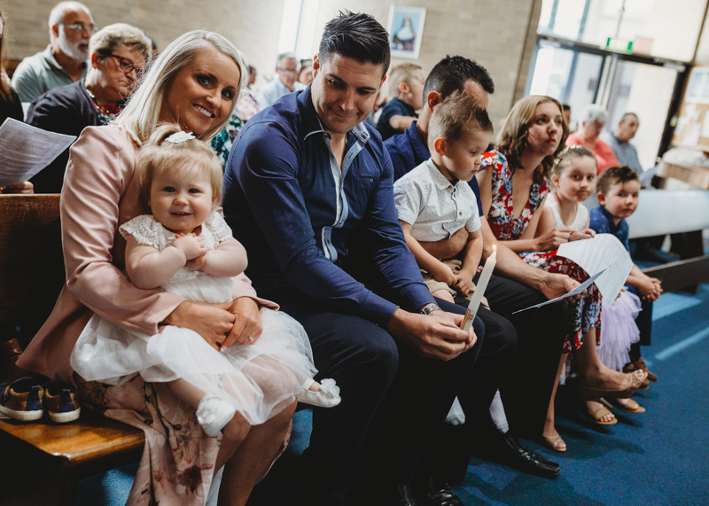 people in church at baby christening