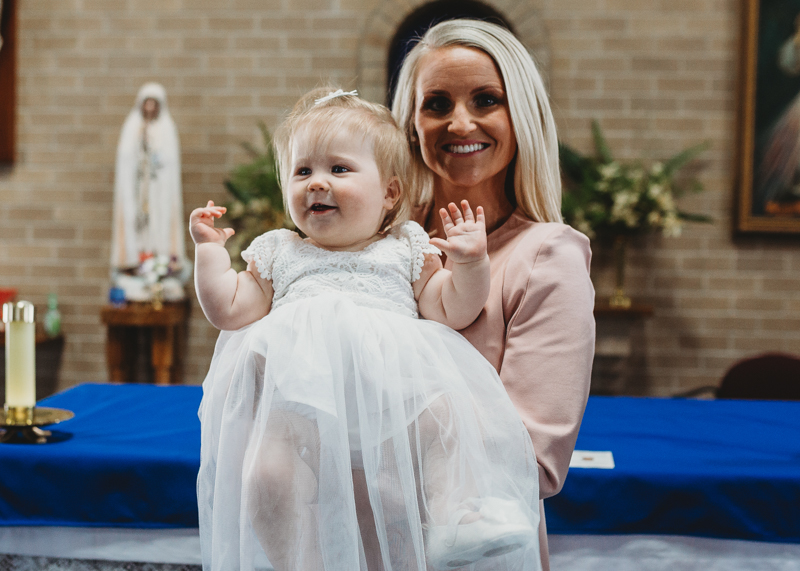 mother with baby at christening