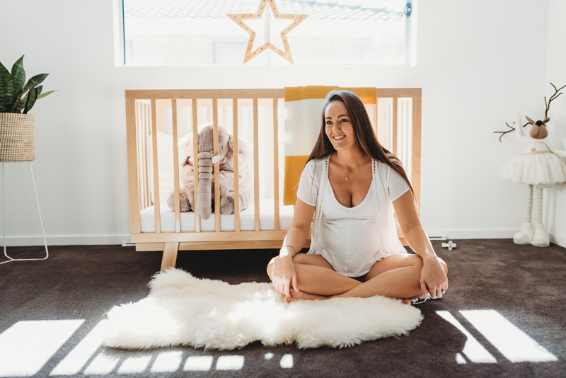 maternity photo shoot in baby’s nursery
