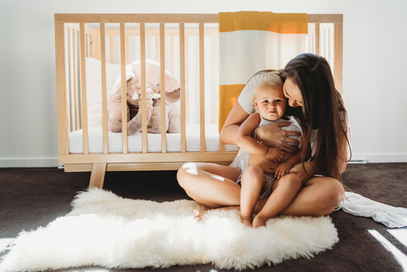 maternity session with toddler in baby’s nursery