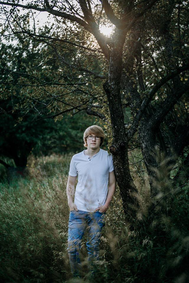young man posing in nature