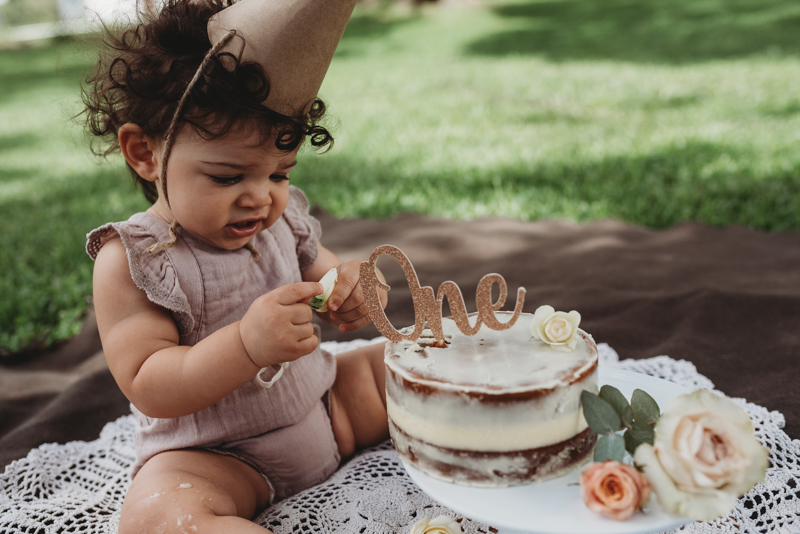first birthday cake and baby girl