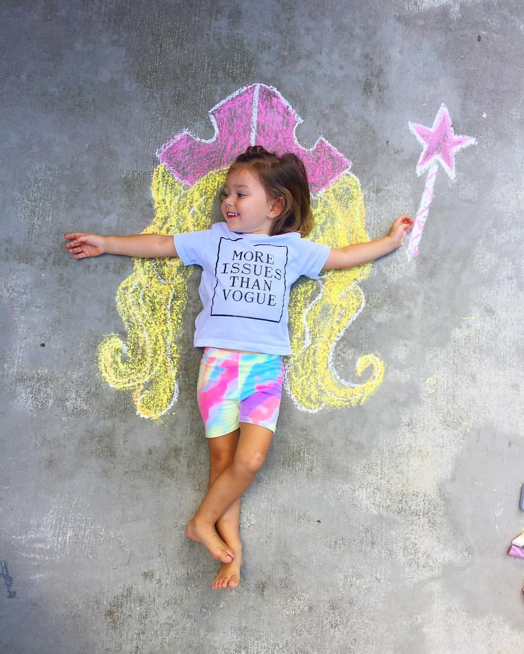 little girl lying on chalk art design