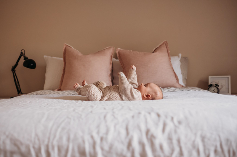 pictures of baby on the centre of the bed