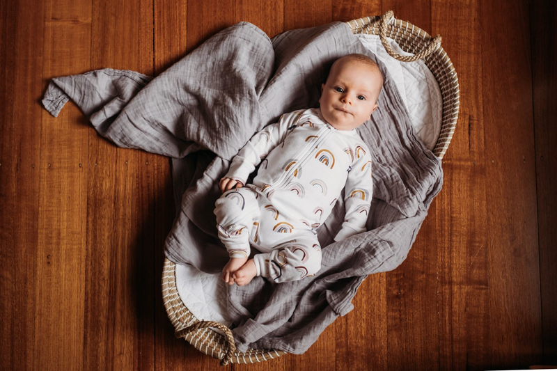 baby photoshoot in bassinet from above