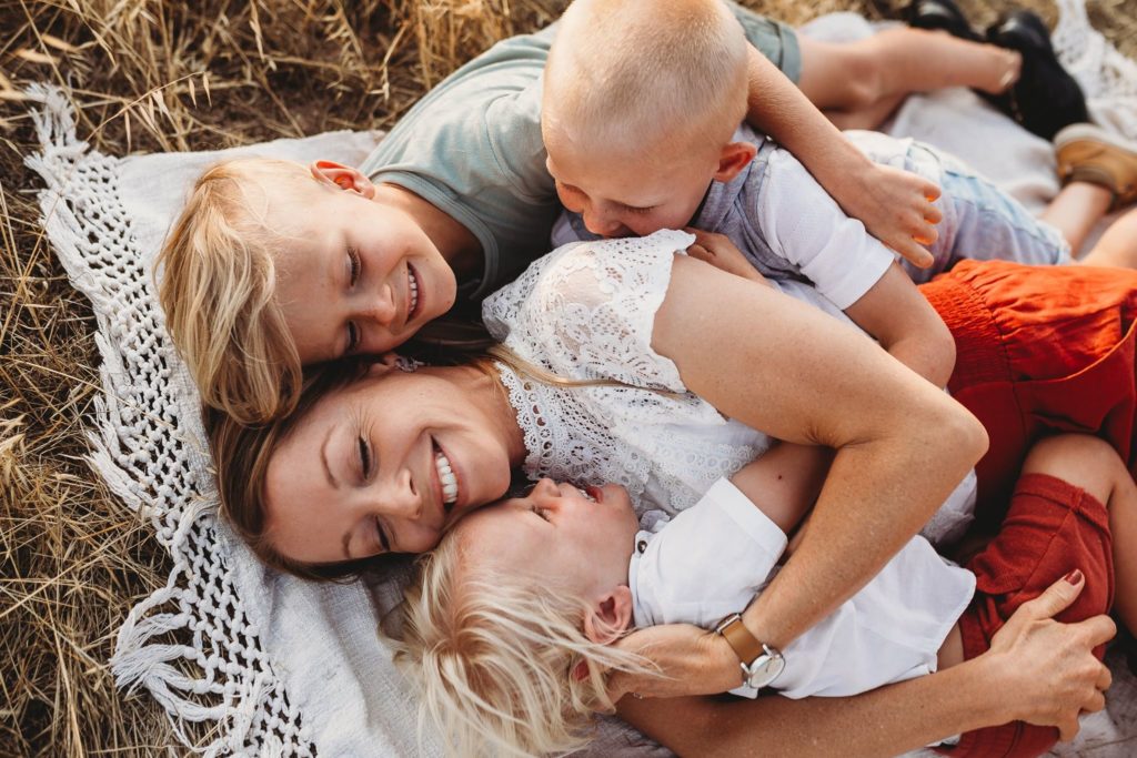 family photo poses with mother and children