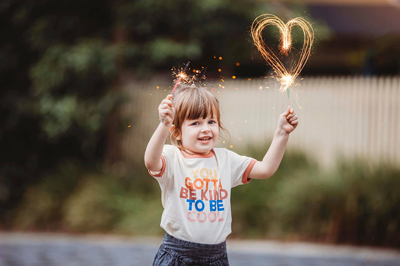 fun picture idea of little girl with fireworks