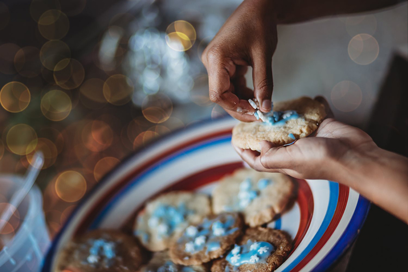 person preparing cookies with background out of focus
