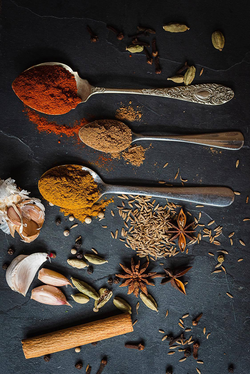  photography composition of spoons and spices