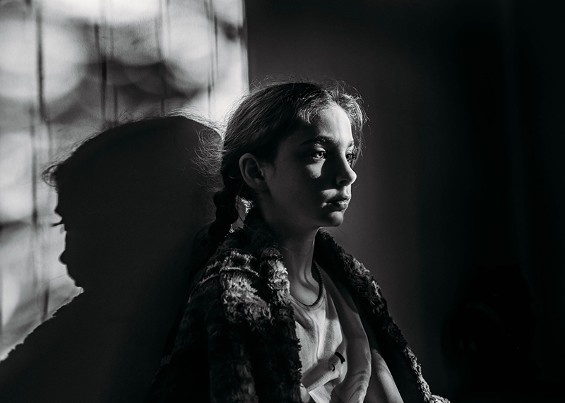 monochrome low light portrait of a girl