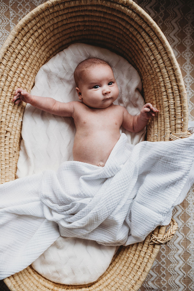  newborn baby in bassinet