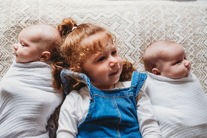 newborn twins with sibling girl