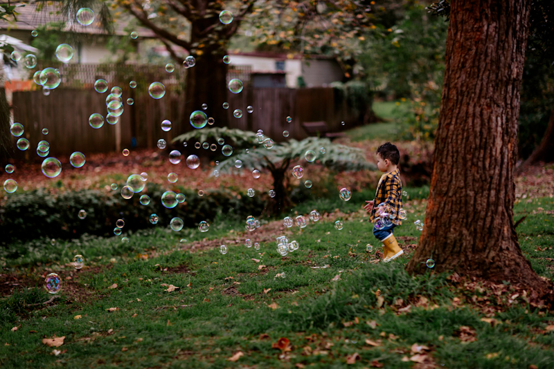 toddler looking at bubbles