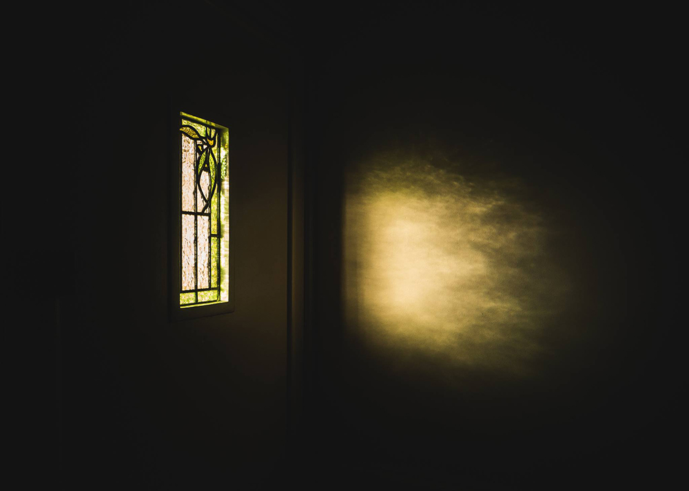 still life grad photo of room with stained glass window