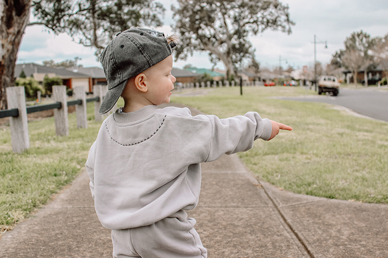 photography courses online toddler boy in grey pointing